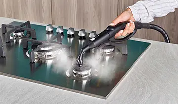 Polti PAEU0393 cleaning cooktop with steam