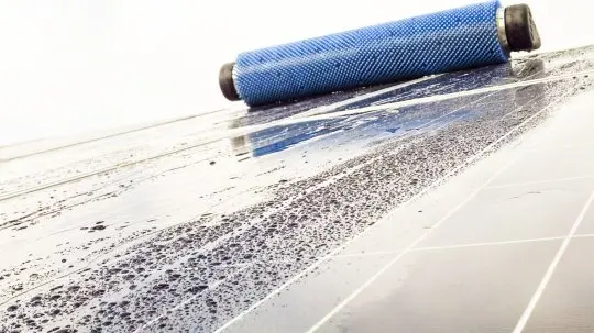 Photovoltaic panel washing brush